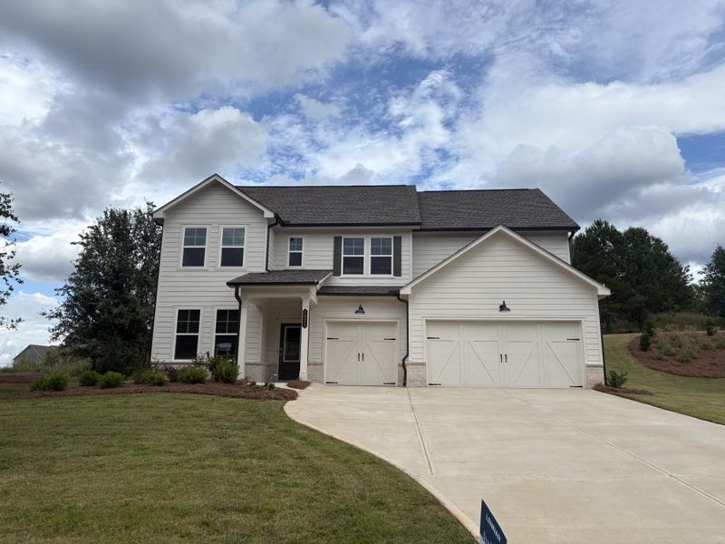 Front exterior of a new home in Wellington Estates, Madison, GA, highlighting curb appeal (Image 1).