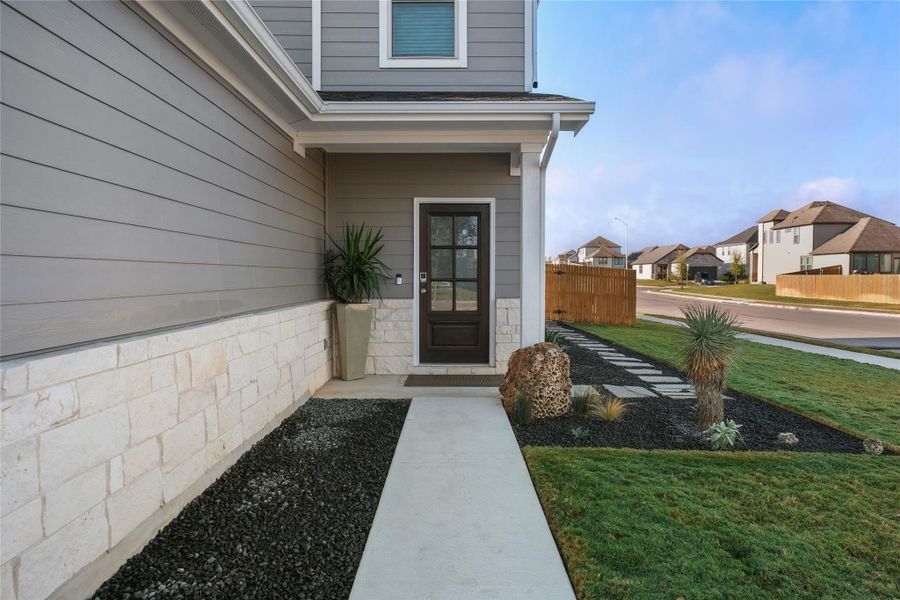 Entrance to property featuring a residential view
