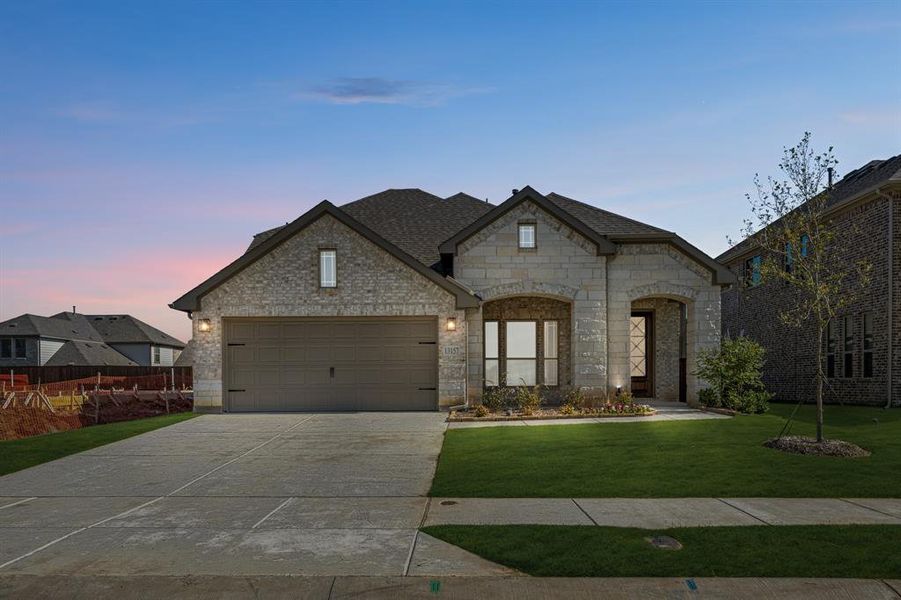 Front exterior of a new home in Woodstone, Providence Village, TX, highlighting curb appeal (Image 19). Front exterior of a new home in Woodstone, Providence Village, TX, highlighting curb appeal (Image 19).