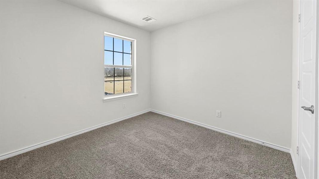 Room featuring neutral wall finishes and grey carpet