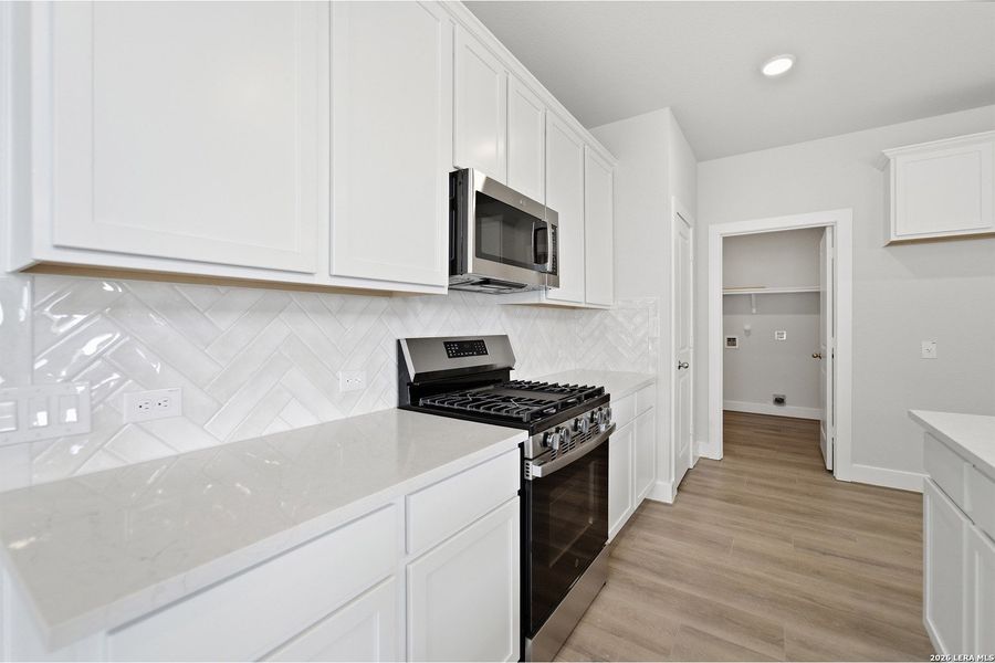 Furnished interior view inside a new home in Hickory Ridge, Elmendorf (Image 13).