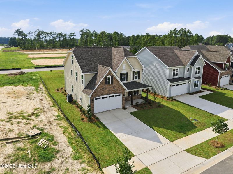 Front exterior of a new home in Legacy Lakes, Aberdeen, NC, highlighting curb appeal (Image 21).