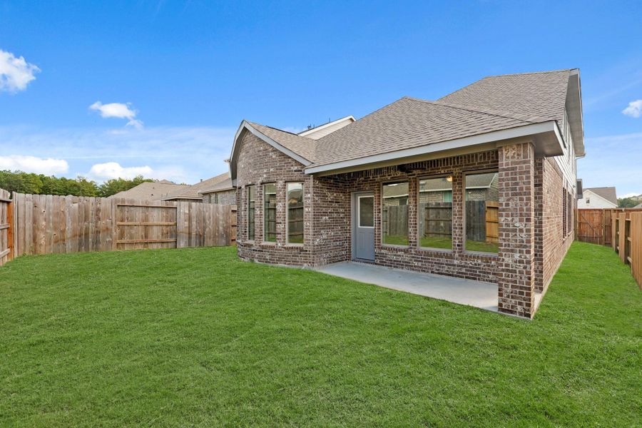 Exterior details and patio area of a home in The Trails, New Caney (Image 19).