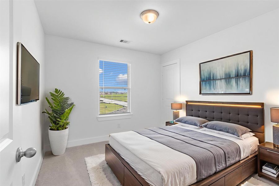 Secondary bedroom with plush carpet, bright natural light, and closet space—ideal for family or guests.  All guest bedrooms have outstanding walk in closets. *Virtually Staged*