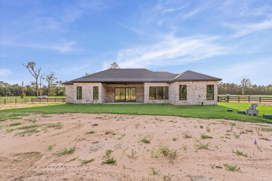 Front exterior of a new home in , Conroe, TX, highlighting curb appeal (Image 21). Front exterior of a new home in , Conroe, TX, highlighting curb appeal (Image 21).