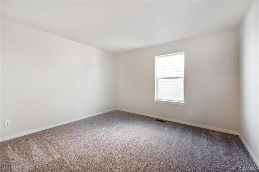 Spacious, unfurnished interior of a new home in The Boulevard II Collection at Windler, Aurora (Image 15).