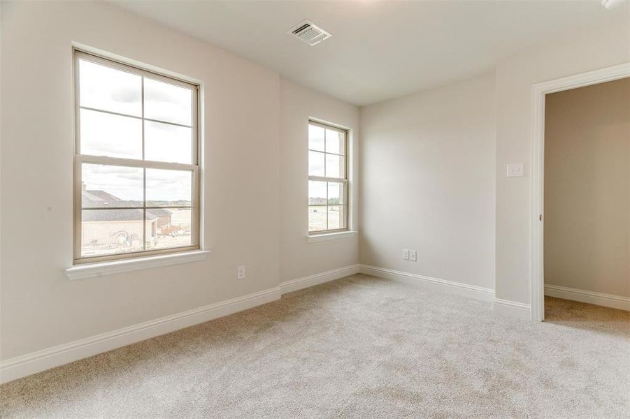 View of carpeted spare room