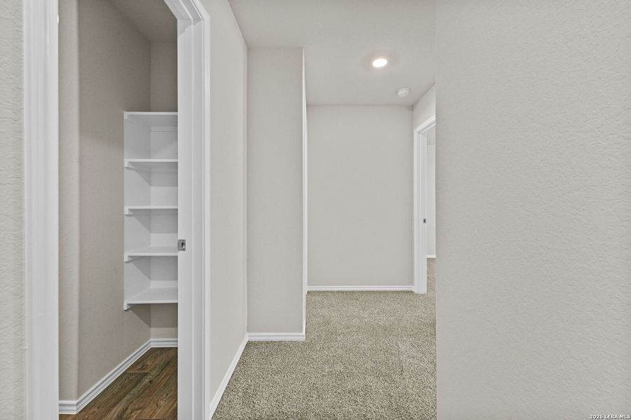 Spacious, unfurnished interior of a new home in Hunters Ranch, San Antonio (Image 27).