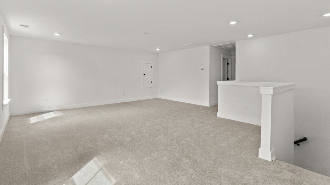 A bright bonus room offers endless options for work, play, or relaxation.