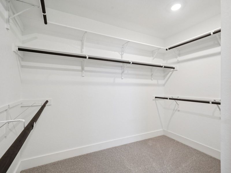 Primary suite walk-in closet in the Red River floorplan at a Meritage Homes community.