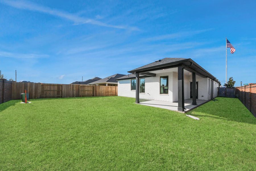 Exterior details and patio area of a home in Sunterra: Premier Collection, Katy (Image 20).