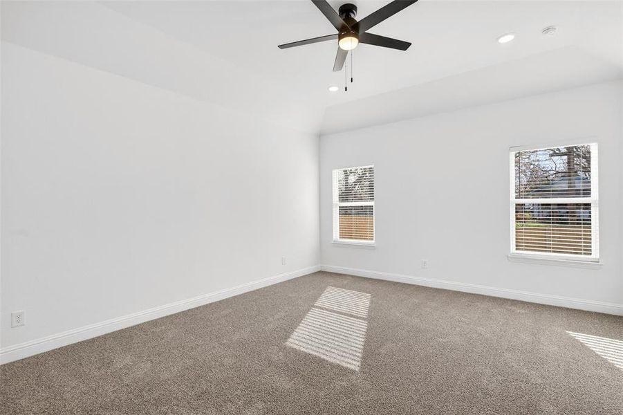 Unfurnished room featuring carpet floors, a ceiling fan, and recessed lighting
