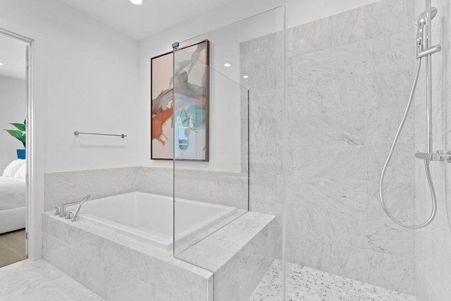Ensuite bathroom featuring a marble finish shower, a garden tub, and recessed lighting