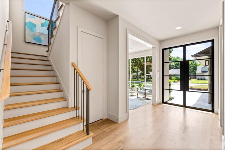 Stairway featuring wood finished floors and recessed lighting Stairway featuring wood finished floors and recessed lighting