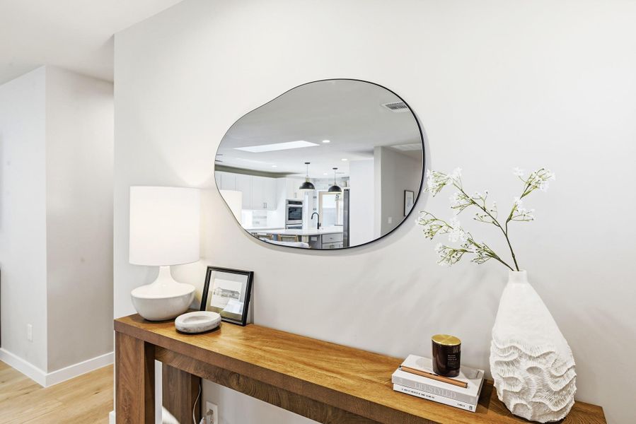 Detailed view of wood finished floors and recessed lighting