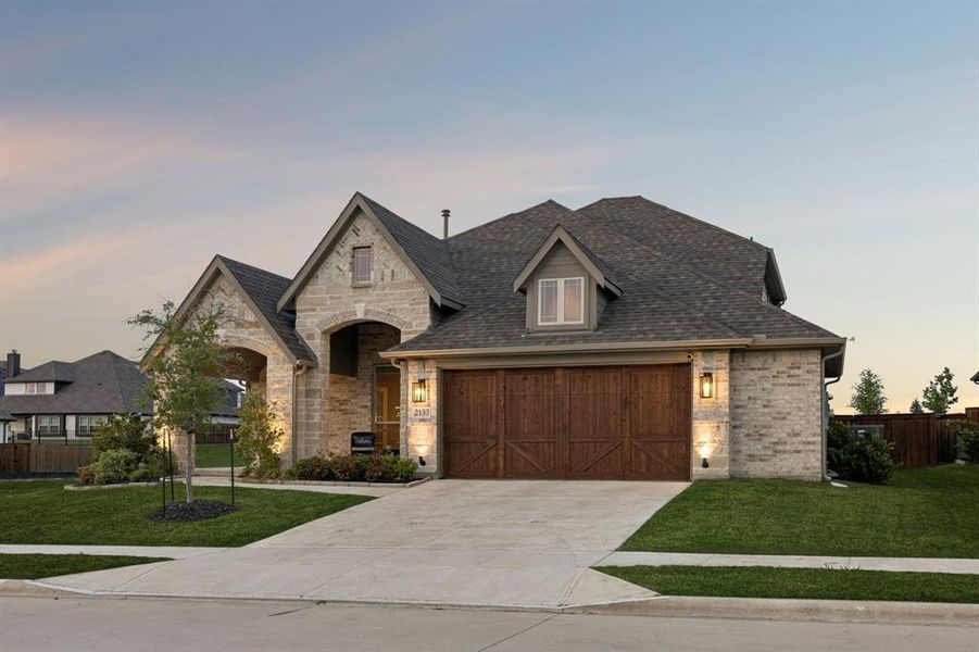 Front exterior of a new home in Devonshire, Forney, TX, highlighting curb appeal (Image 1). Front exterior of a new home in Devonshire, Forney, TX, highlighting curb appeal (Image 1).