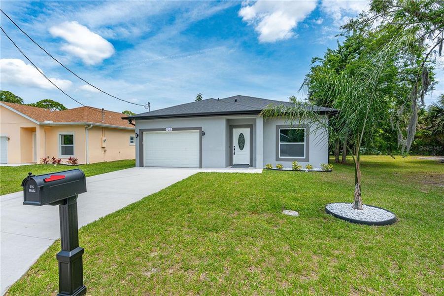 Front exterior of a new home in , Daytona Beach, FL, highlighting curb appeal (Image 28). Front exterior of a new home in , Daytona Beach, FL, highlighting curb appeal (Image 28).
