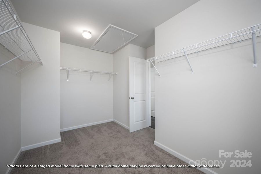 Primary bedroom walk-in closet