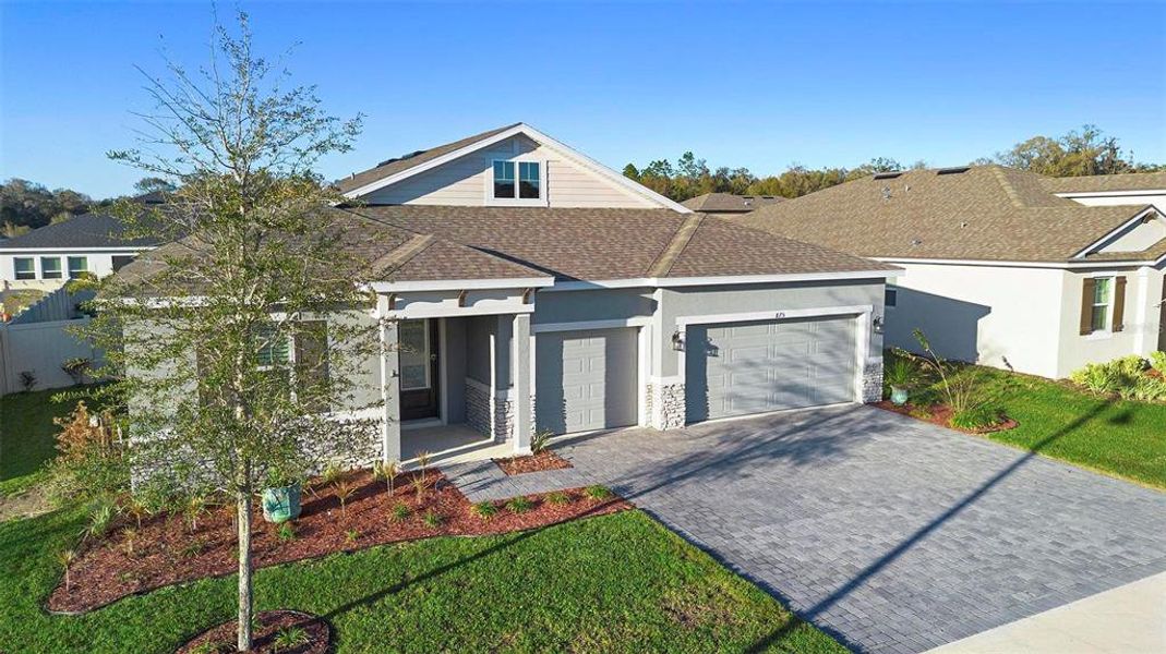 Front exterior of a new home in Addison Landing, Deland, FL, highlighting curb appeal (Image 26).