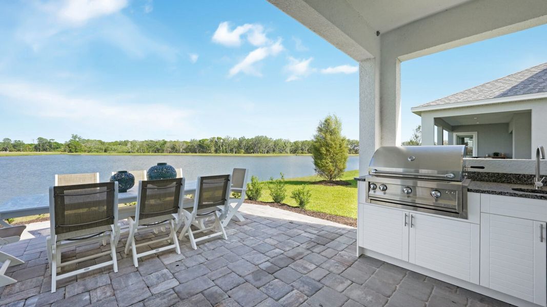 Exterior details and patio area of a home in Wildleaf, Parrish (Image 34).