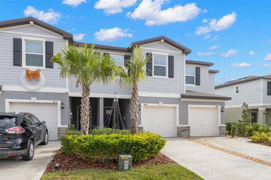 Front exterior of a new home in , Land O' Lakes, FL, highlighting curb appeal (Image 25). Front exterior of a new home in , Land O' Lakes, FL, highlighting curb appeal (Image 25).