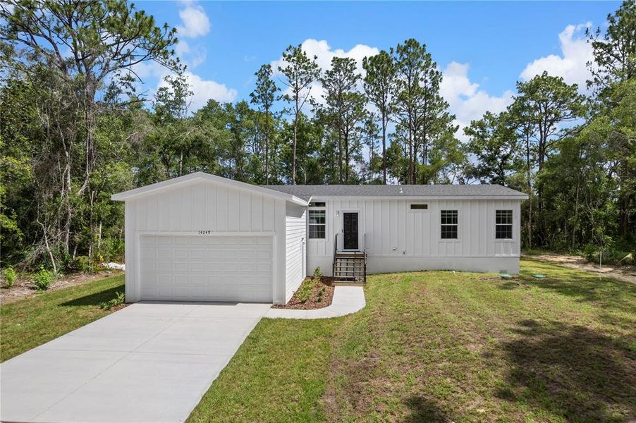 Front exterior of a new home in , Weeki Wachee, FL, highlighting curb appeal (Image 2). Front exterior of a new home in , Weeki Wachee, FL, highlighting curb appeal (Image 2).