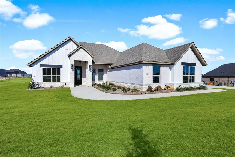 Front exterior of a new home in , Weatherford, TX, highlighting curb appeal (Image 1). Front exterior of a new home in , Weatherford, TX, highlighting curb appeal (Image 1).