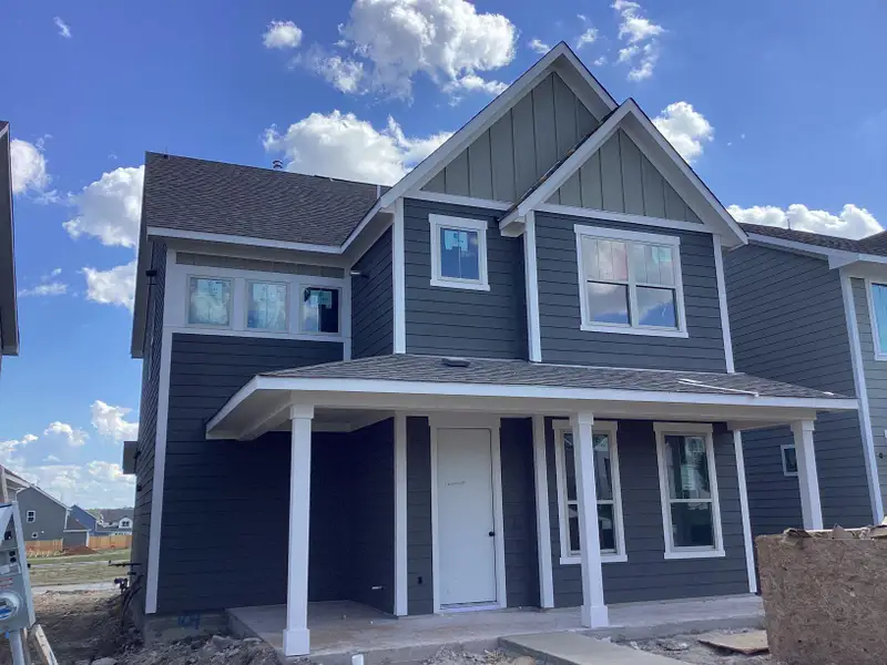 Front exterior of a new home in The Cottages at Lariat, Liberty Hill, TX, highlighting curb appeal (Image 2).