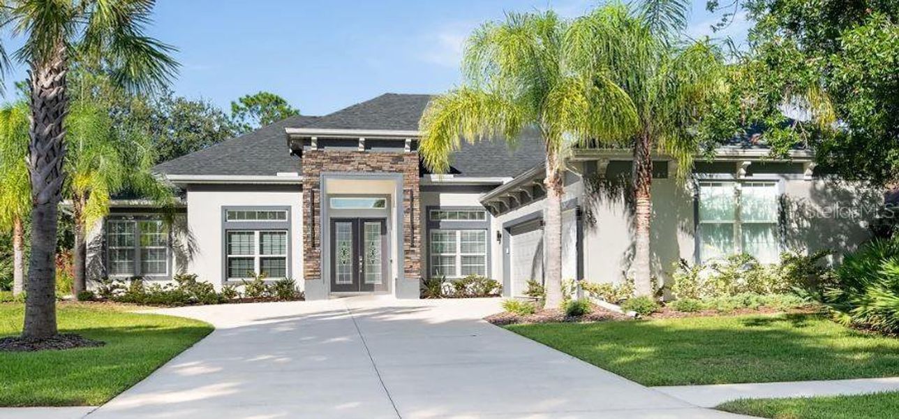 Front exterior of a new home in , Palm Coast, FL, highlighting curb appeal (Image 1).