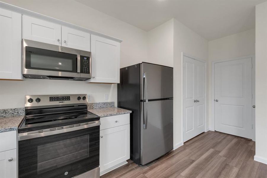 Furnished interior view inside a new home in Creekview Fossil Ridge, Pilot Point (Image 11).