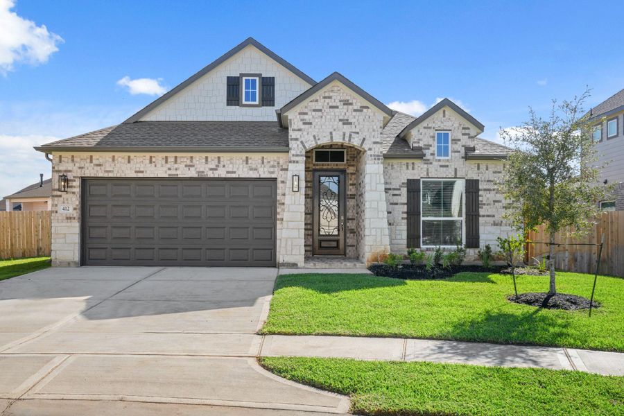 Front exterior of a new home in Beacon Hill, Waller, TX, highlighting curb appeal (Image 2). Front exterior of a new home in Beacon Hill, Waller, TX, highlighting curb appeal (Image 2).