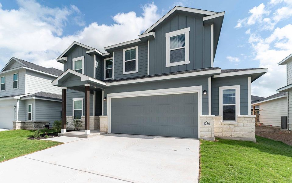 Front exterior of a new home in Swenson Heights, Seguin, TX, highlighting curb appeal (Image 1).