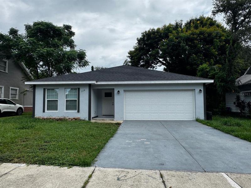 Front exterior of a new home in , Winter Haven, FL, highlighting curb appeal (Image 27). Front exterior of a new home in , Winter Haven, FL, highlighting curb appeal (Image 27).