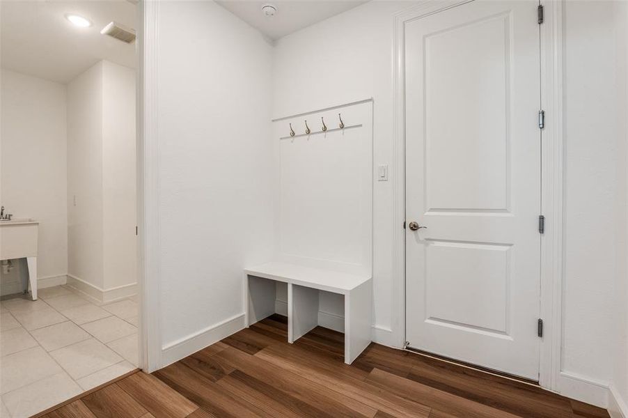 Mudroom featuring baseboards and wood finished floors Mudroom featuring baseboards and wood finished floors