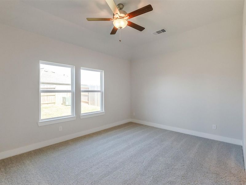 Spacious, unfurnished interior of a new home in Sunterra, Katy (Image 29).