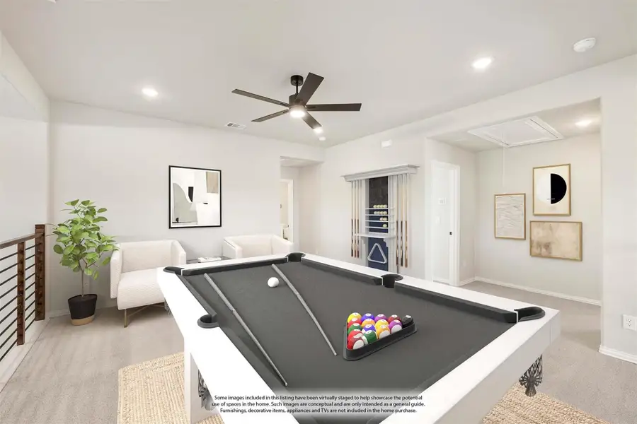 Game room with pool table, ceiling fan, seating area, and cue rack on carpeted floor Game room with pool table, ceiling fan, seating area, and cue rack on carpeted floor