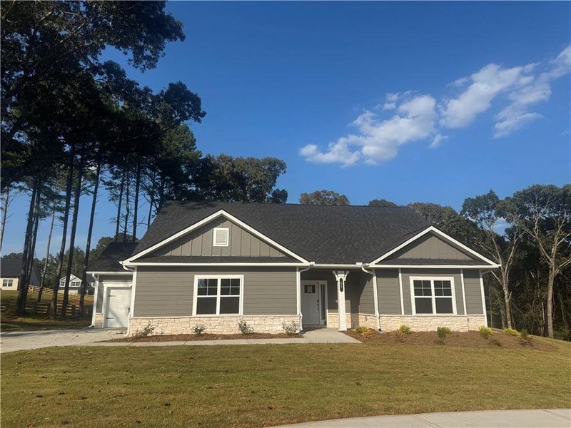 Front exterior of a new home in The Fields of Walnut Creek, Pendergrass, GA, highlighting curb appeal (Image 1).