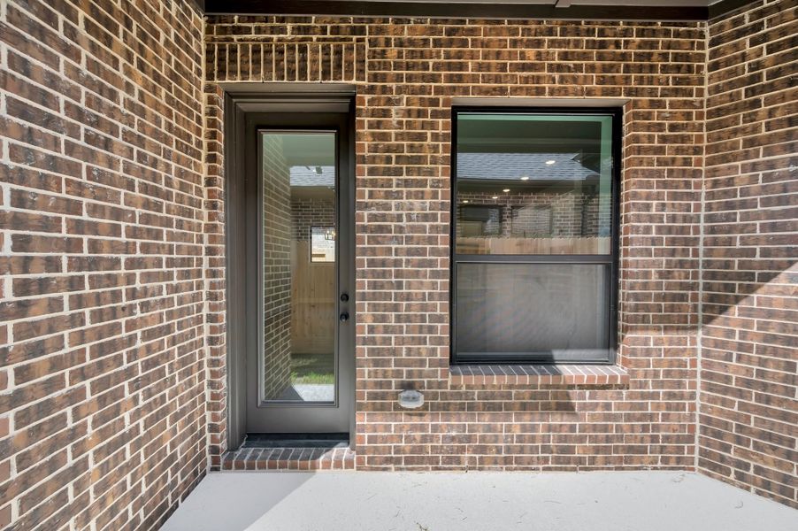Exterior details and patio area of a home in Sienna - Grove Collection, Missouri City (Image 4).