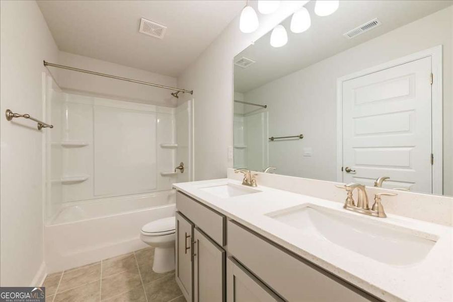 Furnished interior view inside a new home in Carson's Walk, Macon (Image 12).