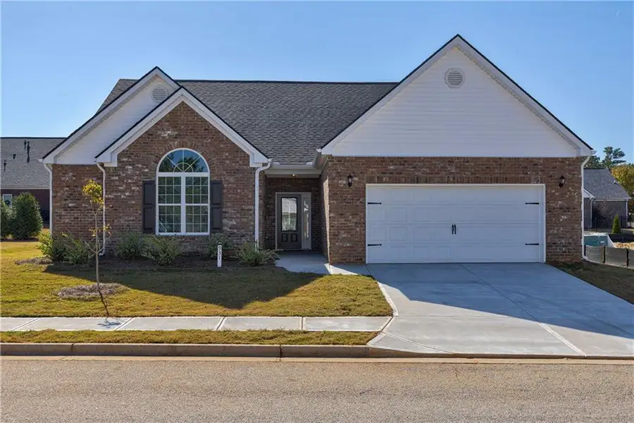 Front exterior of a new home in , Social Circle, GA, highlighting curb appeal (Image 2). Front exterior of a new home in , Social Circle, GA, highlighting curb appeal (Image 2).