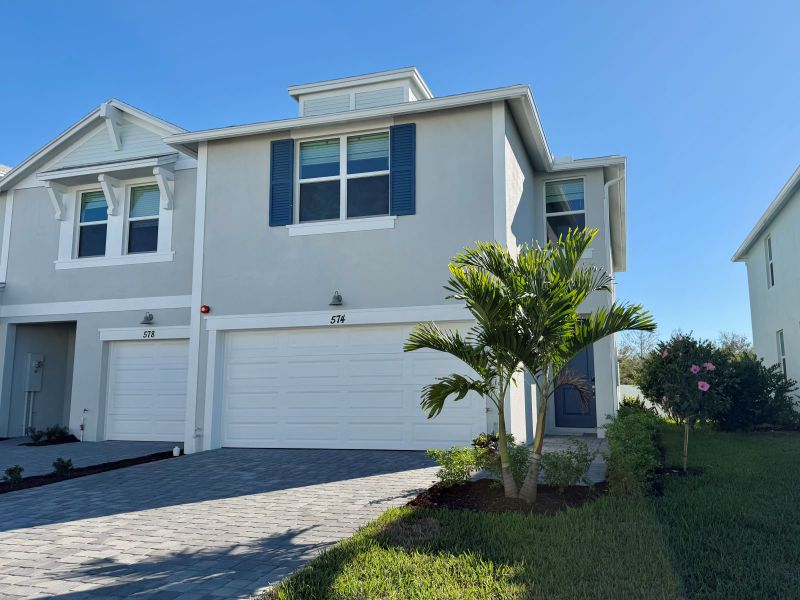 Front exterior of a new home in Tidewater, Fort Pierce, FL, highlighting curb appeal (Image 2). Front exterior of a new home in Tidewater, Fort Pierce, FL, highlighting curb appeal (Image 2).