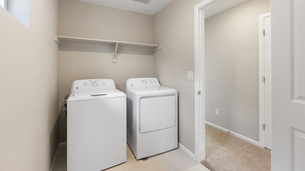 Furnished interior view inside a new home in Woodrose at Painted Prairie, Aurora (Image 6).
