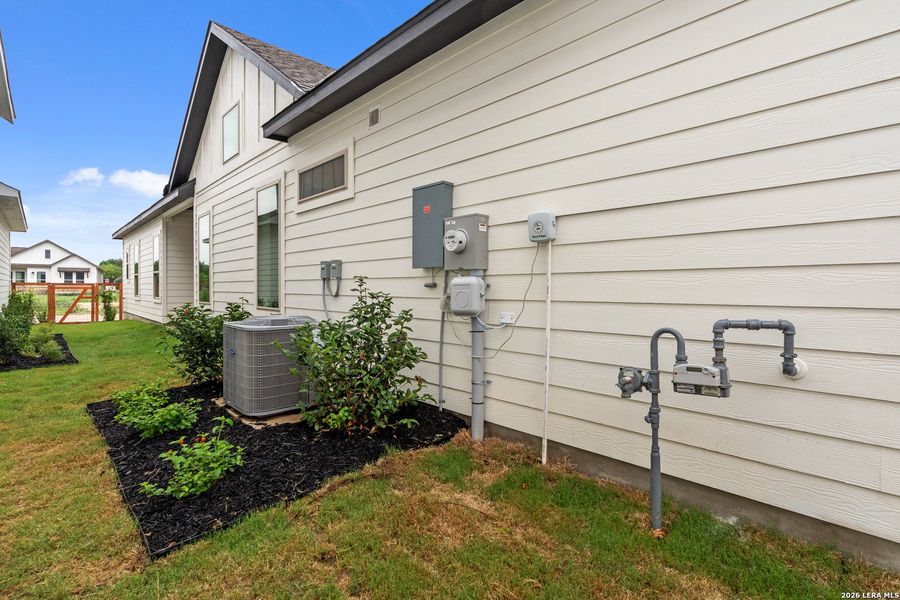 Exterior details and patio area of a home in The Crossvine, Schertz (Image 3).