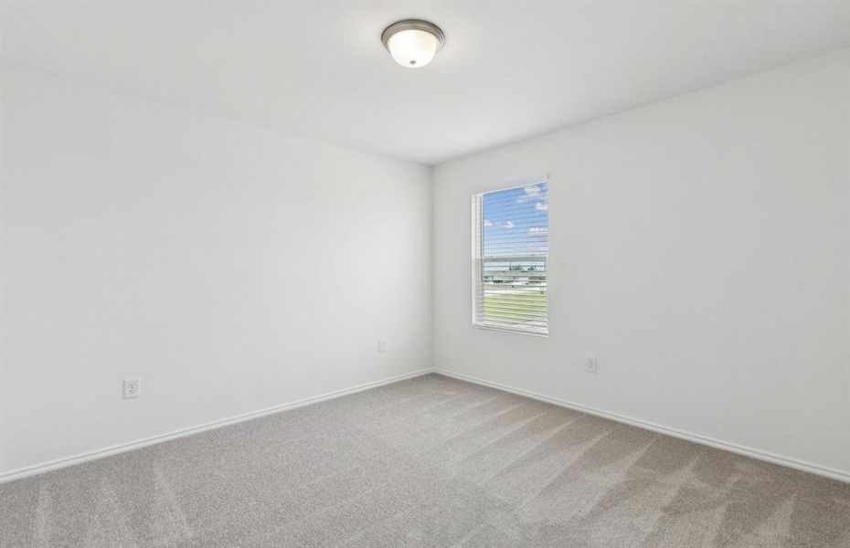 Spacious secondary bedroom with large window Spacious secondary bedroom with large window