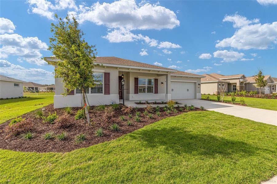 Front exterior of a new home in , Ocala, FL, highlighting curb appeal (Image 18).