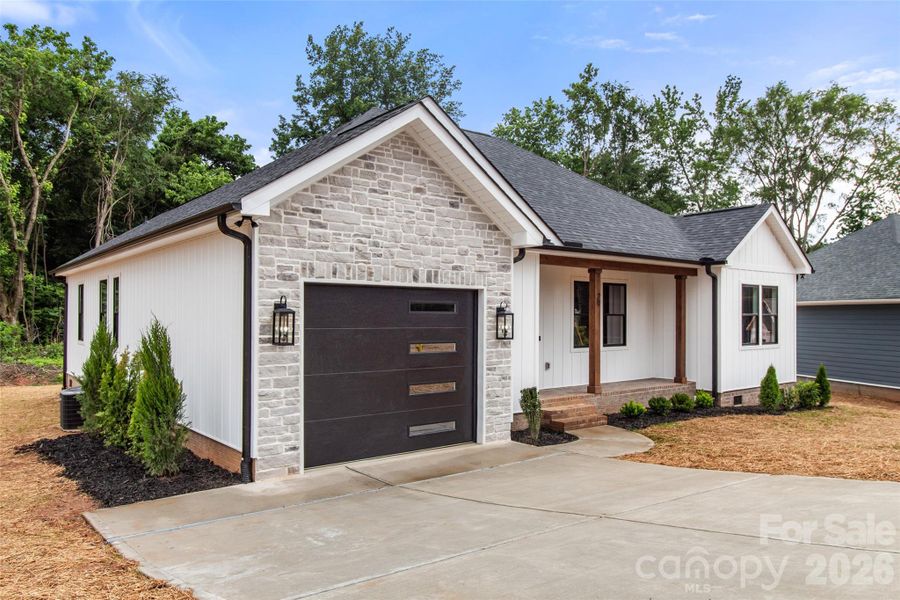 Front exterior of a new home in , Concord, NC, highlighting curb appeal (Image 16). Front exterior of a new home in , Concord, NC, highlighting curb appeal (Image 16).