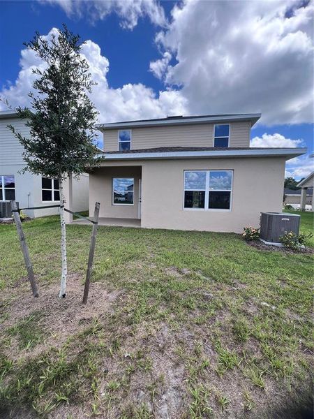 Front exterior of a new home in , Harmony, FL, highlighting curb appeal (Image 2).