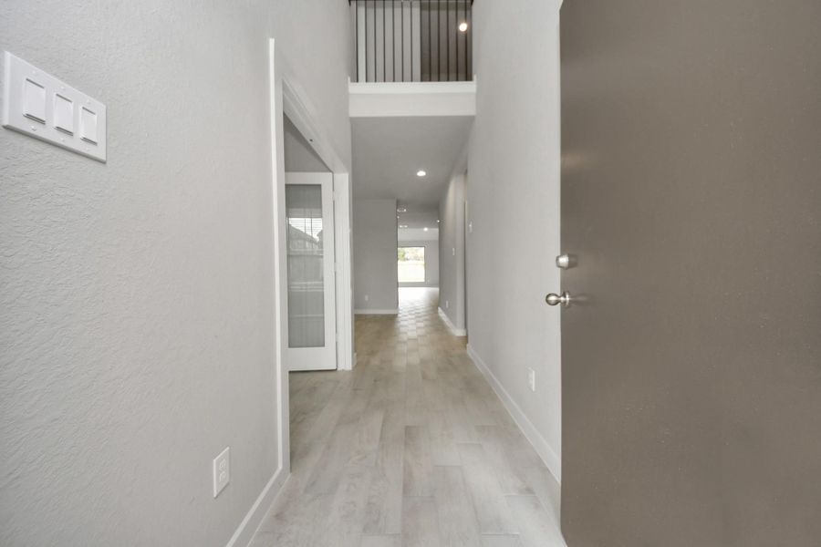 As you step into the threshold of this luxurious home, you'll soon be welcomed by anelegant glass door (to be installed). Inside, soaring ceilings amplify the spaciousness,while the refined wood-look tile flooring and oversized baseboards exudesophistication and charm. Sample photo of completed home with similar floor plan. Actual colors and selections may vary. As you step into the threshold of this luxurious home, you'll soon be welcomed by anelegant glass door (to be installed). Inside, soaring ceilings amplify the spaciousness,while the refined wood-look tile flooring and oversized baseboards exudesophistication and charm. Sample photo of completed home with similar floor plan. Actual colors and selections may vary.