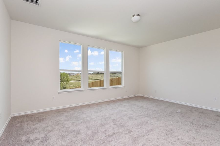 Spacious, unfurnished interior of a new home in Hidden Bluffs at TRP, San Antonio (Image 5).