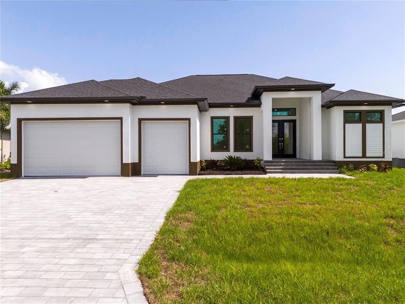 Front exterior of a new home in , Port Charlotte, FL, highlighting curb appeal (Image 1). Front exterior of a new home in , Port Charlotte, FL, highlighting curb appeal (Image 1).